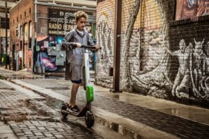 Boy riding an e-scooter